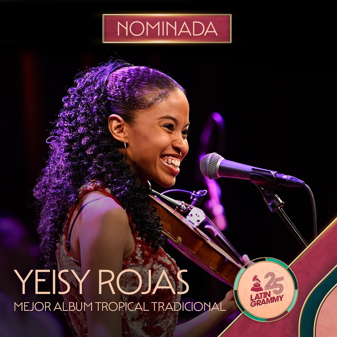 YEISY ROJAS holding violins and smiling for the Latin Grammy Nomination